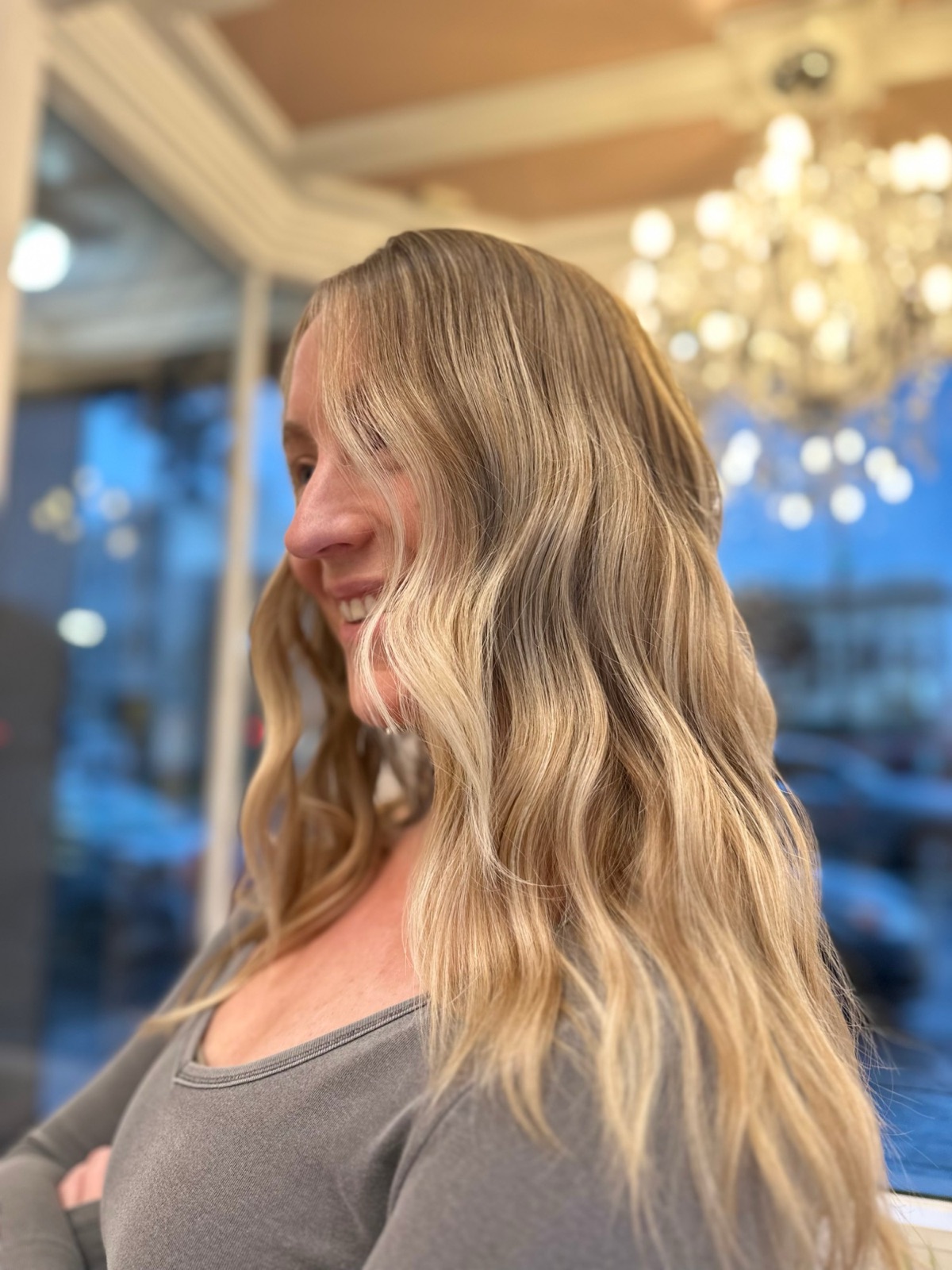 Client with long, lived-in blonde waves